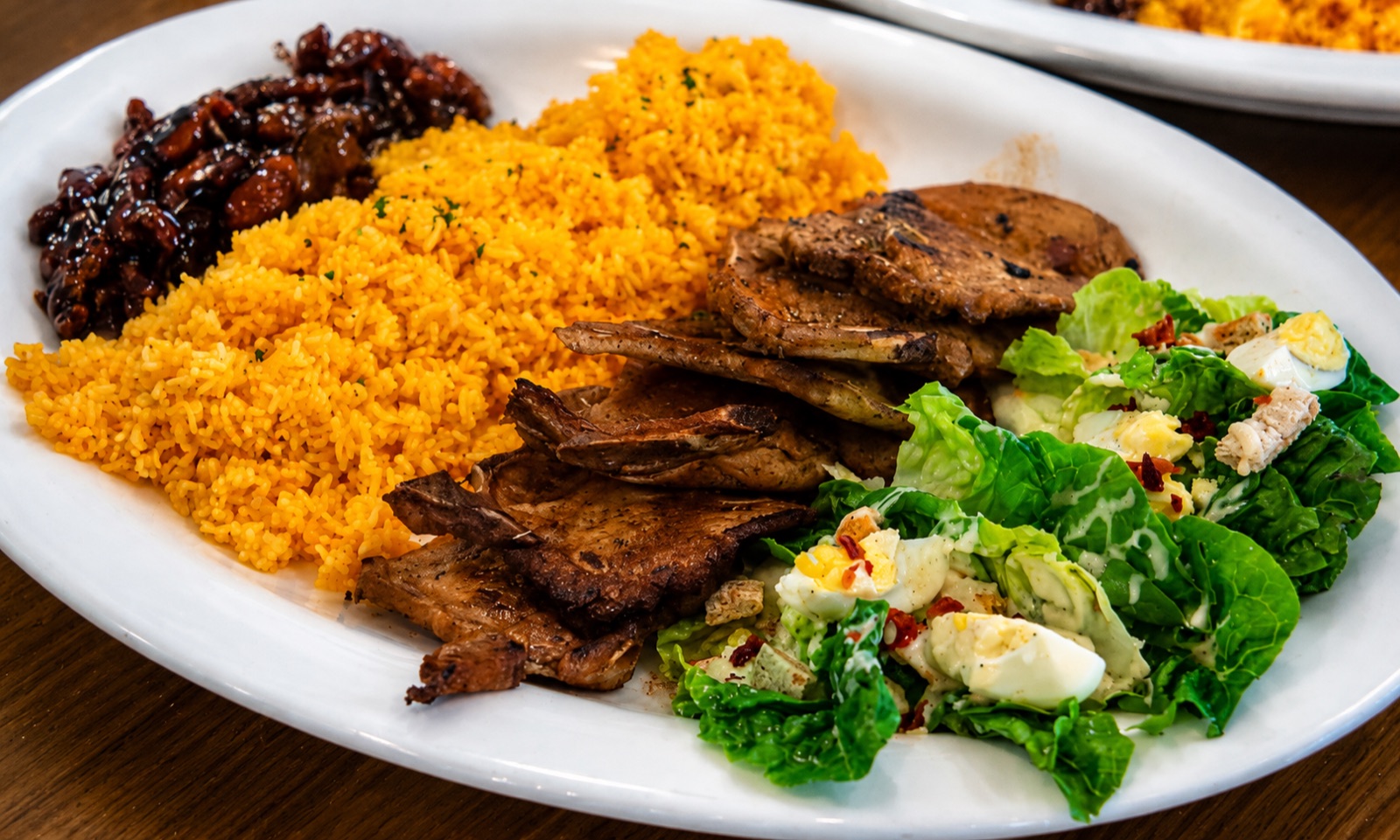 Sharing platter — garlic rice, beef, longganisa and salad